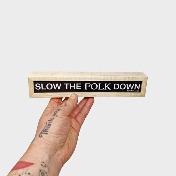 SLOW THE FOLK DOWN Sign